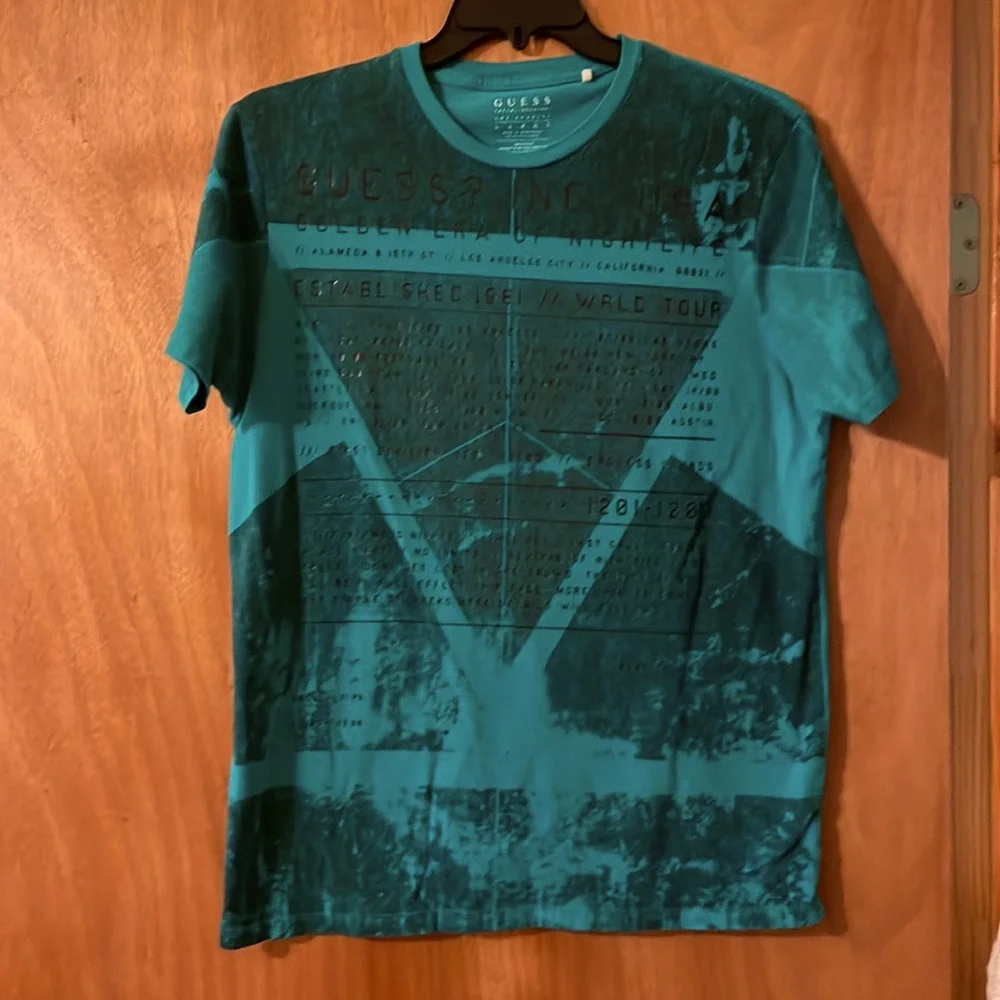 GUESS WRLD TOUR Golden era of nightlife teal t-shirt Play to Win (mlb)